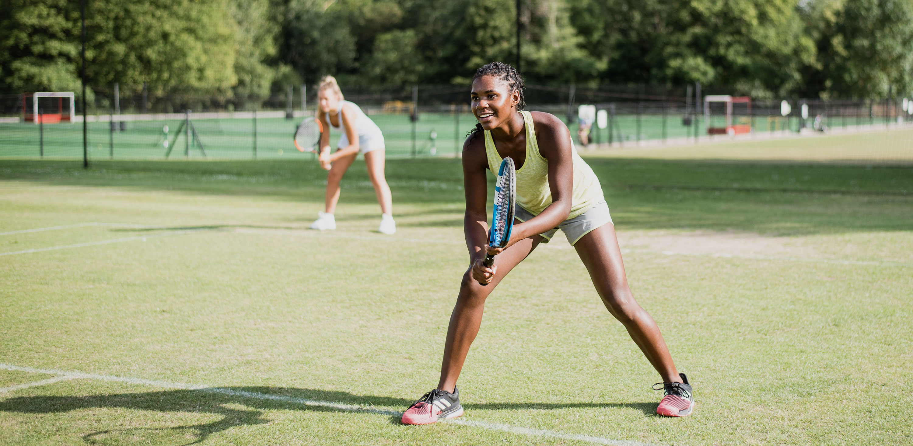 students playing tennis